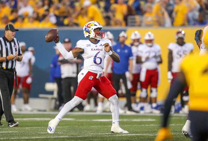 Sep 10, 2022; Morgantown, West Virginia, USA; Kansas Jayhawks quarterback Jalon Daniels (6) passes the ball against the West Virginia Mountaineers during the second quarter at Mountaineer Field at Milan Puskar Stadium. Mandatory Credit: Ben Queen-USA TODAY Sports